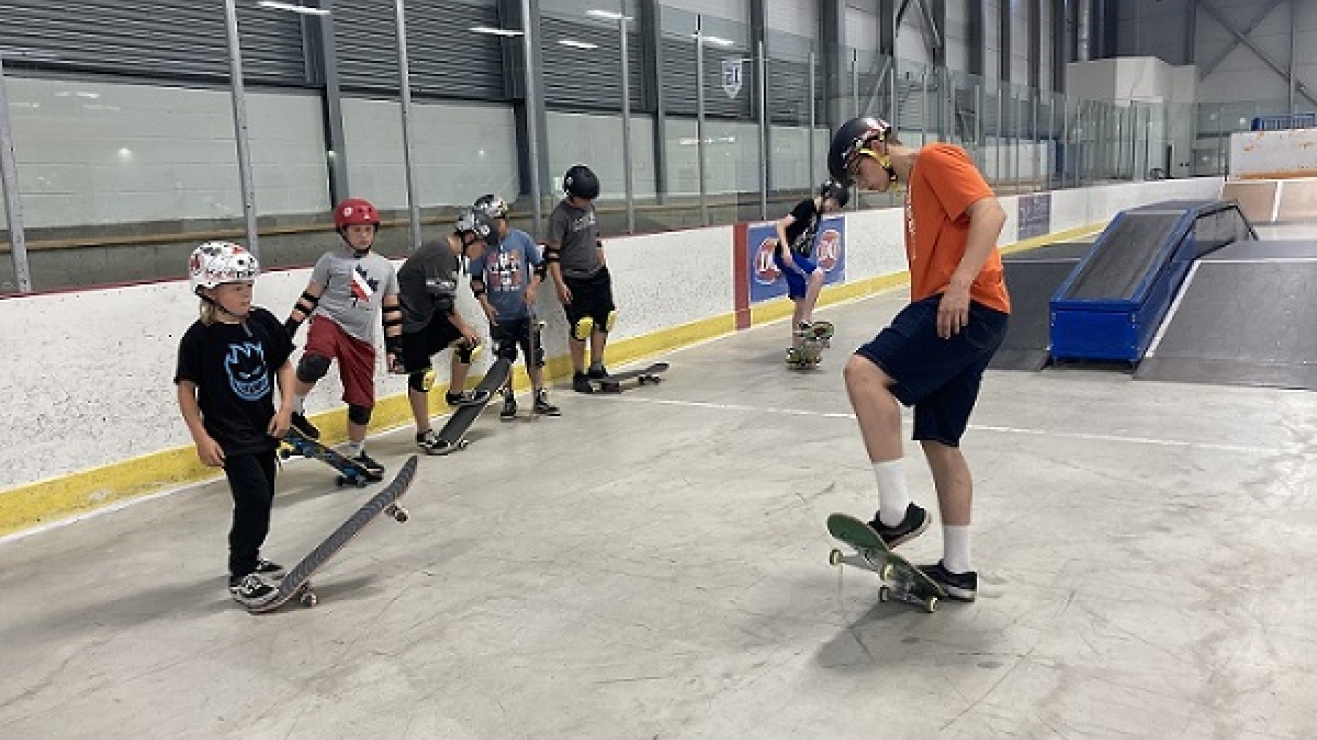 Kids learning to skateboard